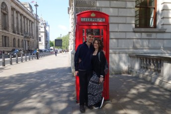 In front of a phone booth!